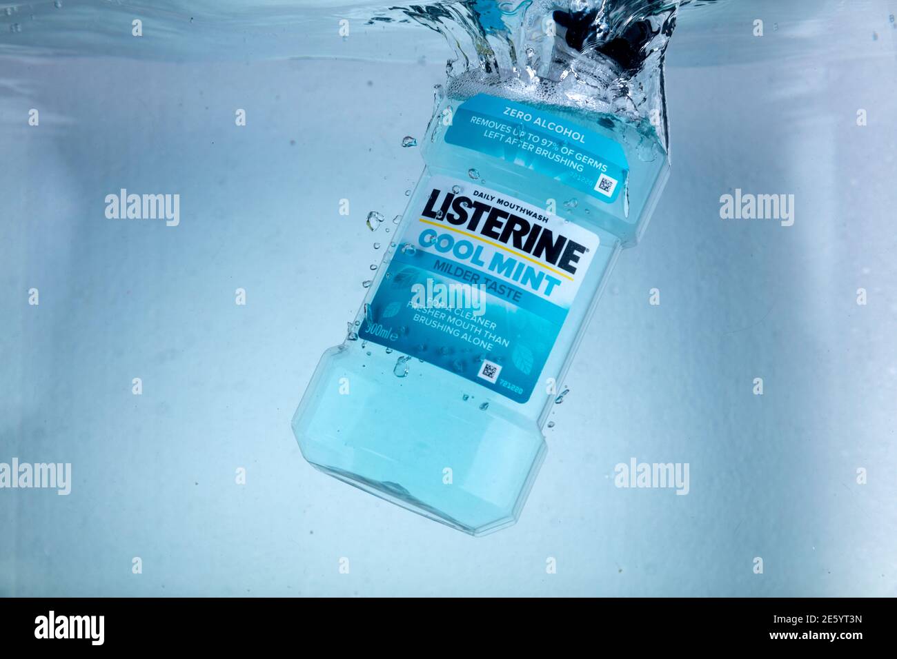 Hispeed shot of a bottle of Listerine mouthwash dropping into water