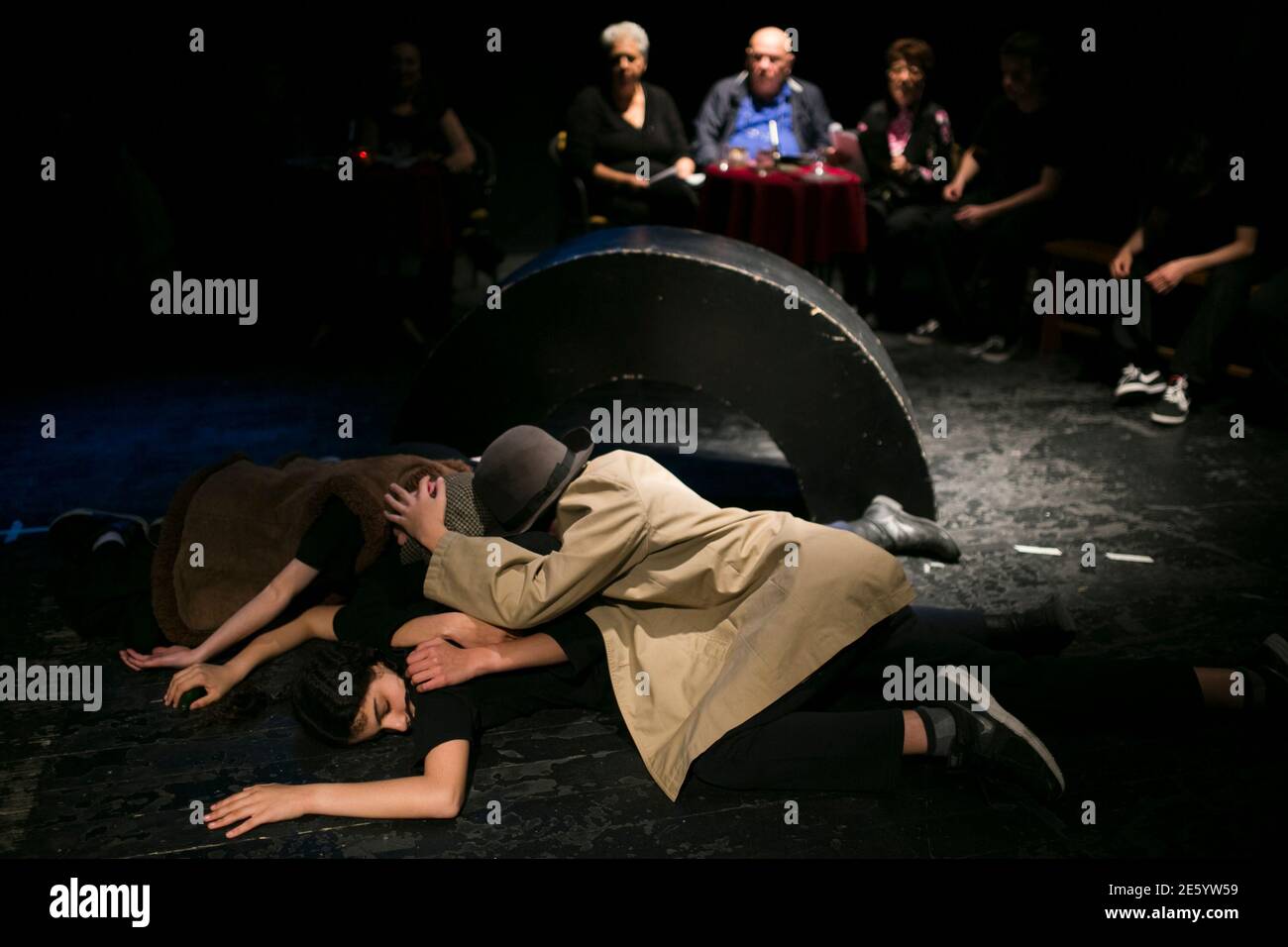 Israeli teenagers and Holocaust survivors (rear) perform during a dress rehearsal, part of an educational project, in Shoham near Tel Aviv March 23, 2014. Testimony Theater Project, established by Ezra and Irit Dagan in 2000, brings together teenagers, between the ages of 13 to 15, and Holocaust survivors, who share personal experiences that are adapted into a collaborative theater production in which they perform. The organization has also worked on similar projects in the United States and Germany. Israel on April 28, 2014, commemorates the six million Jews killed by the Nazis in the Holocau Stock Photo