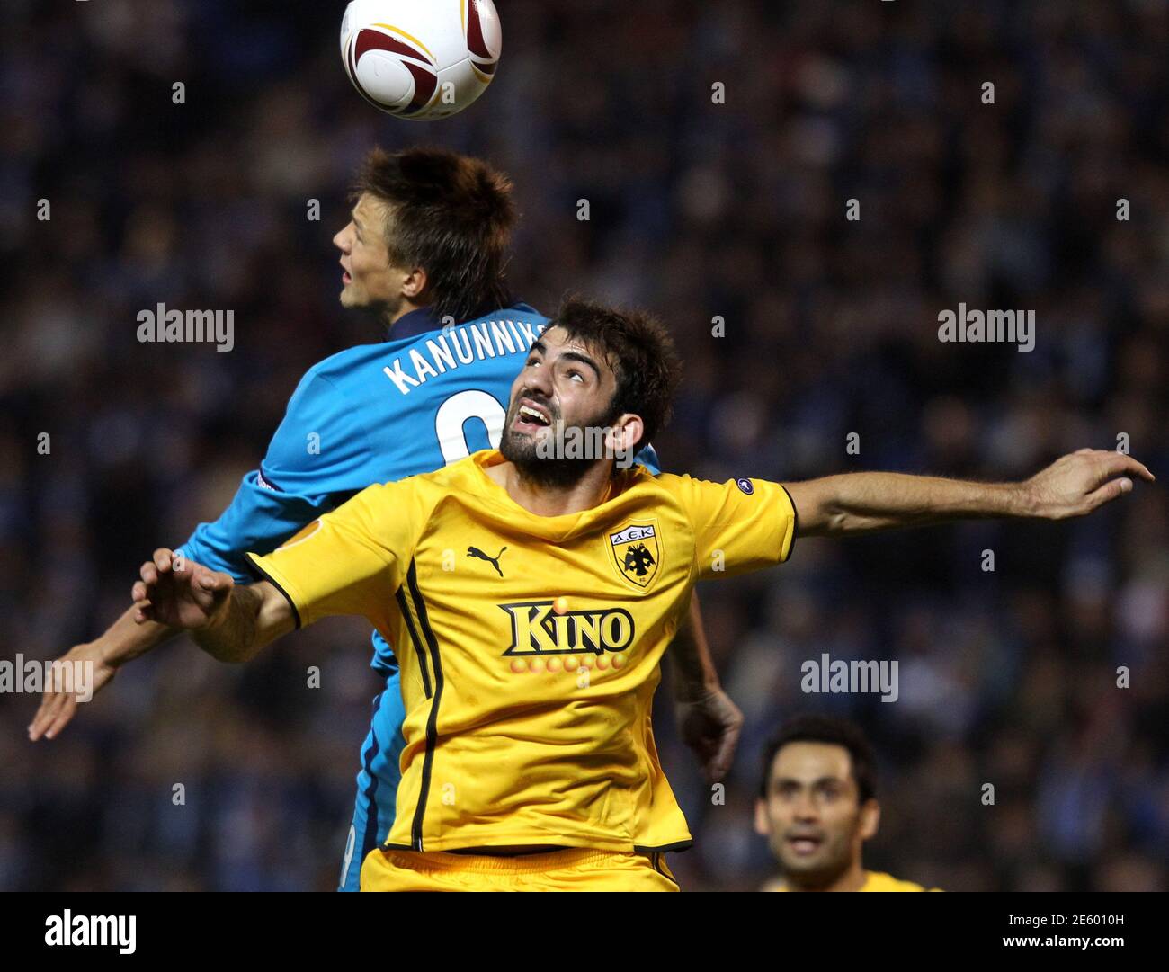 AEK Athen's Grigoris Makos (R) challenges Zenit St Petersburg's Maksim  Kanunnikov during their Europa League soccer match at the Petrovsky stadium  in St.Petersburg September 30, 2010. REUTERS/Alexander Demianchuk(RUSSIA -  Tags: SPORT SOCCER