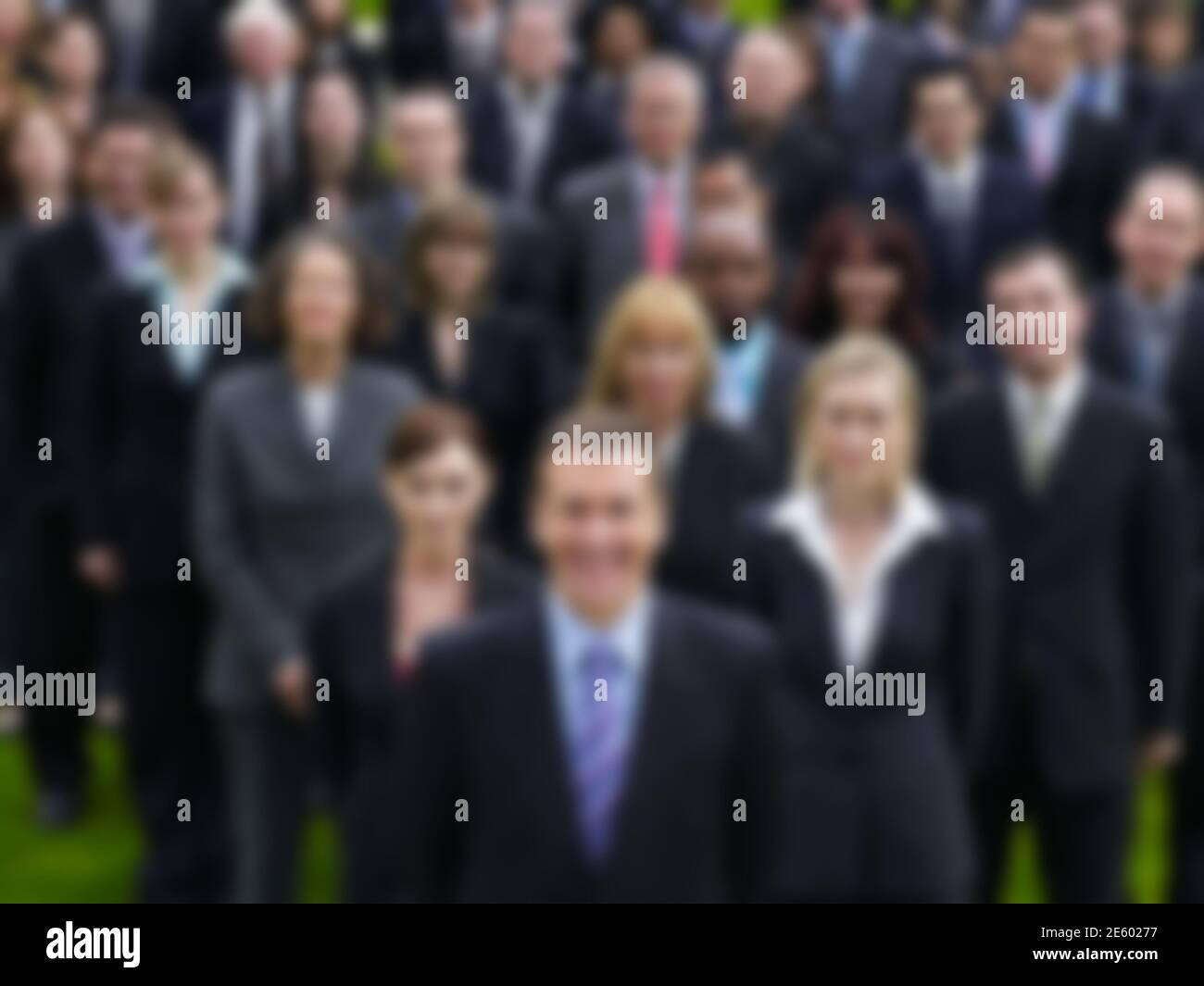 Multi ethnic group of business people standing together Stock Photo - Alamy