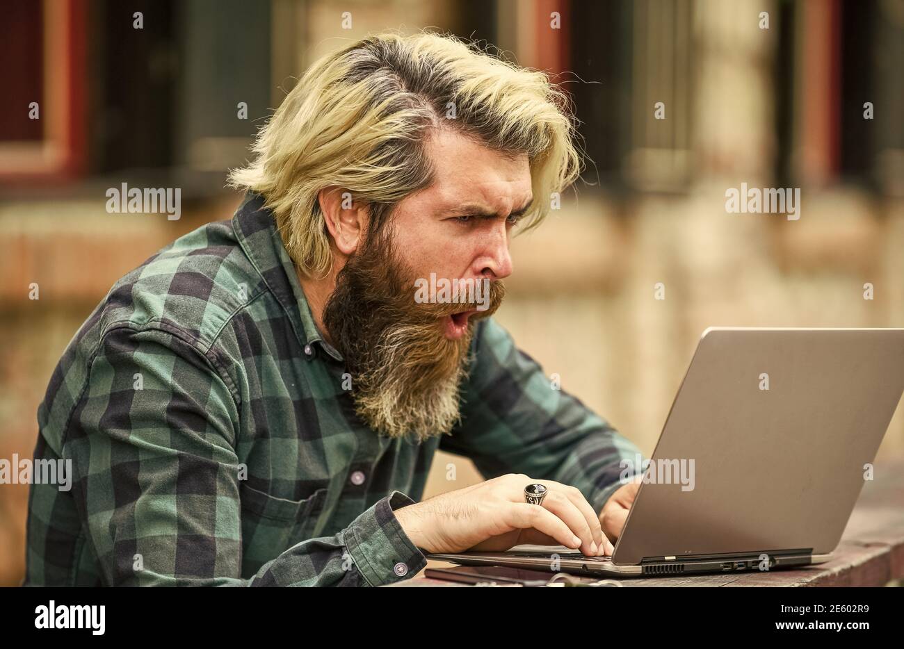 Businessman laptop terrace. Online education. Surfing internet. Modern communication. Risky shopping. Stock trader. Online business. Online entrepreneur working outdoors. Man busy work with laptop. Stock Photo
