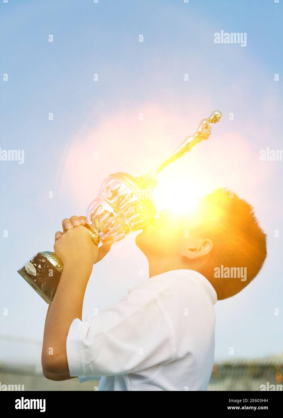 Portrait of Tennis Player Kissing Trophy Stock Photo