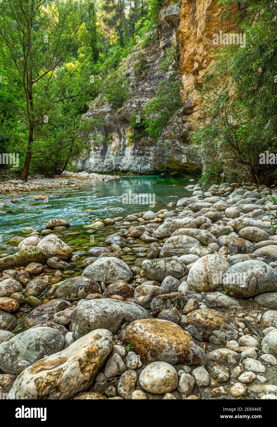 Stony shore of a mountain river which has reached the valley. Orte Nature Reserve, Abruzzo, Italy, Europe Stock Photo