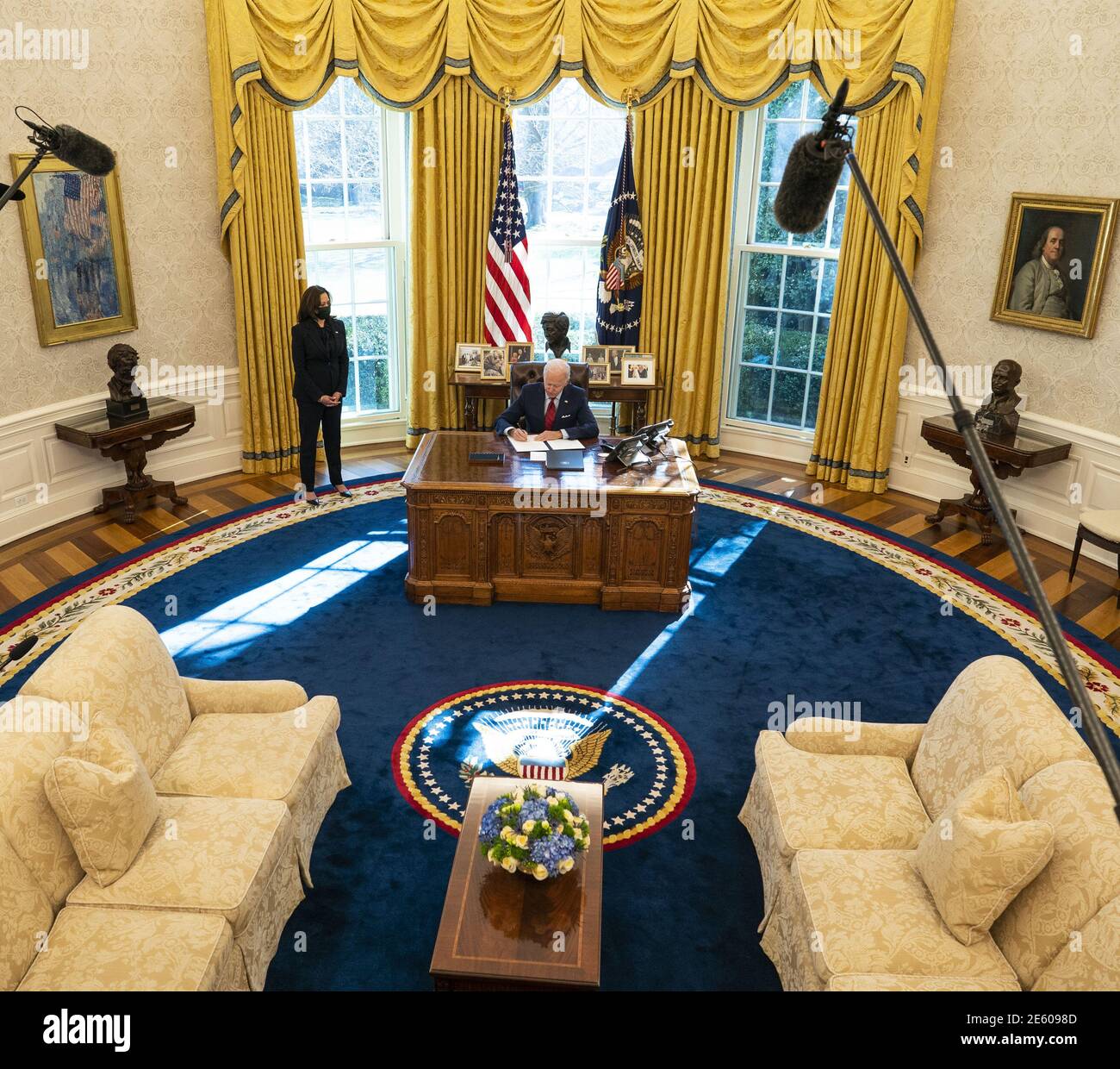 Washington, United States. 28th Jan, 2021. President Joe Biden signs executive actions strengthening Americans' access to quality, affordable health care, in the Oval Office of the White House on Thursday, January 26, 2021. Vice President Kamala Harris is at left. Pool Photo by Doug Mills/UPI Credit: UPI/Alamy Live News Stock Photo