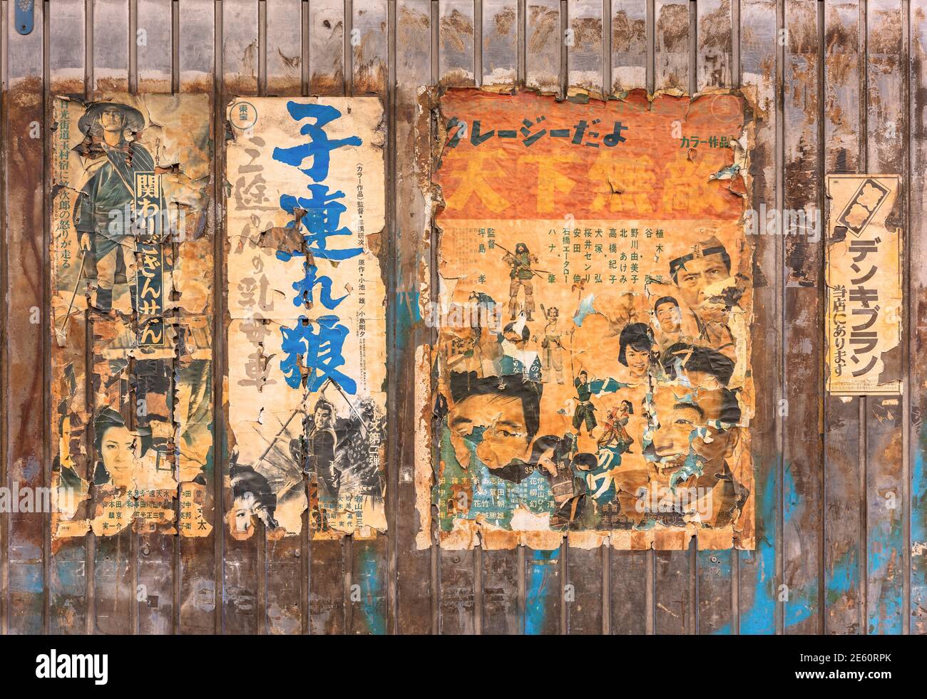 Tokyo Japan January 26 21 Torn Old Vintage Japanese Posters Of Samurai Retro Movies And Brandy Cocktail Stuck On The Rusted Wall Of Yuraku Conco Stock Photo Alamy