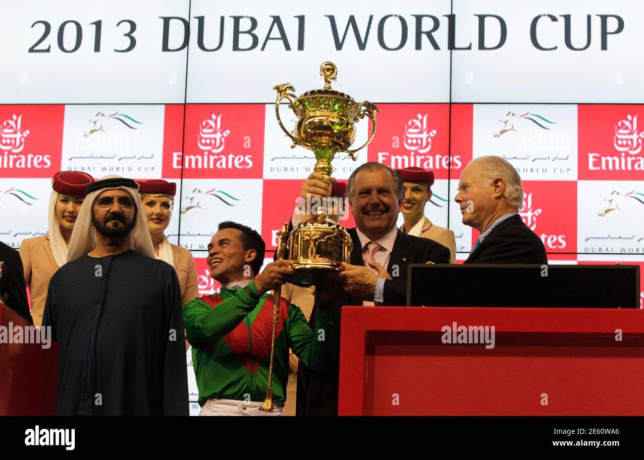 United Arab Emirates' Prime Minister and Ruler of Dubai Sheikh Mohammed bin  Rashid al-Maktoum (front L) looks on as Joel Rosario, who competed on Animal  Kingdom of the ., celebrates with the