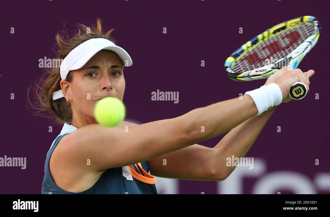Petra Cetkovska of Czech Republic returns the ball to Angelique Kerber of  Germany during their women's singles quarter-finals match at the Qatar Open  tennis tournament in Doha February 14, 2014. Cetkovska lost