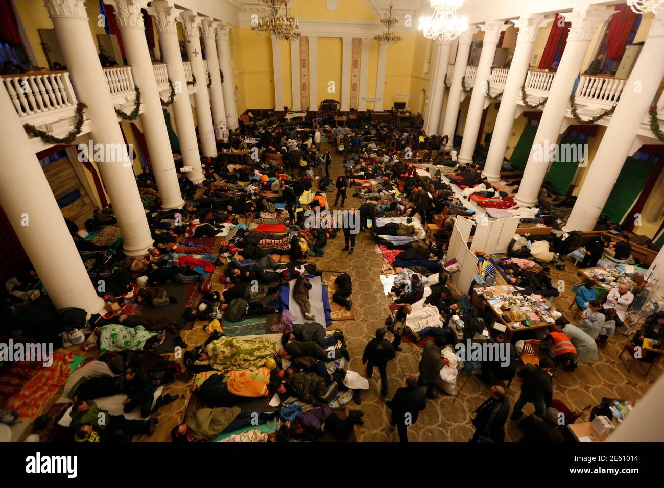 Anti-government protesters sleep in City Hall in Kiev February 21, 2014. Ukrainian President Viktor Yanukovich said on Friday a deal to resolve his country's political crisis had been reached with pro-European opposition leaders after the worst violence since Soviet times, but France urged caution. REUTERS/Baz Ratner (UKRAINE - Tags: POLITICS CIVIL UNREST) Stock Photo