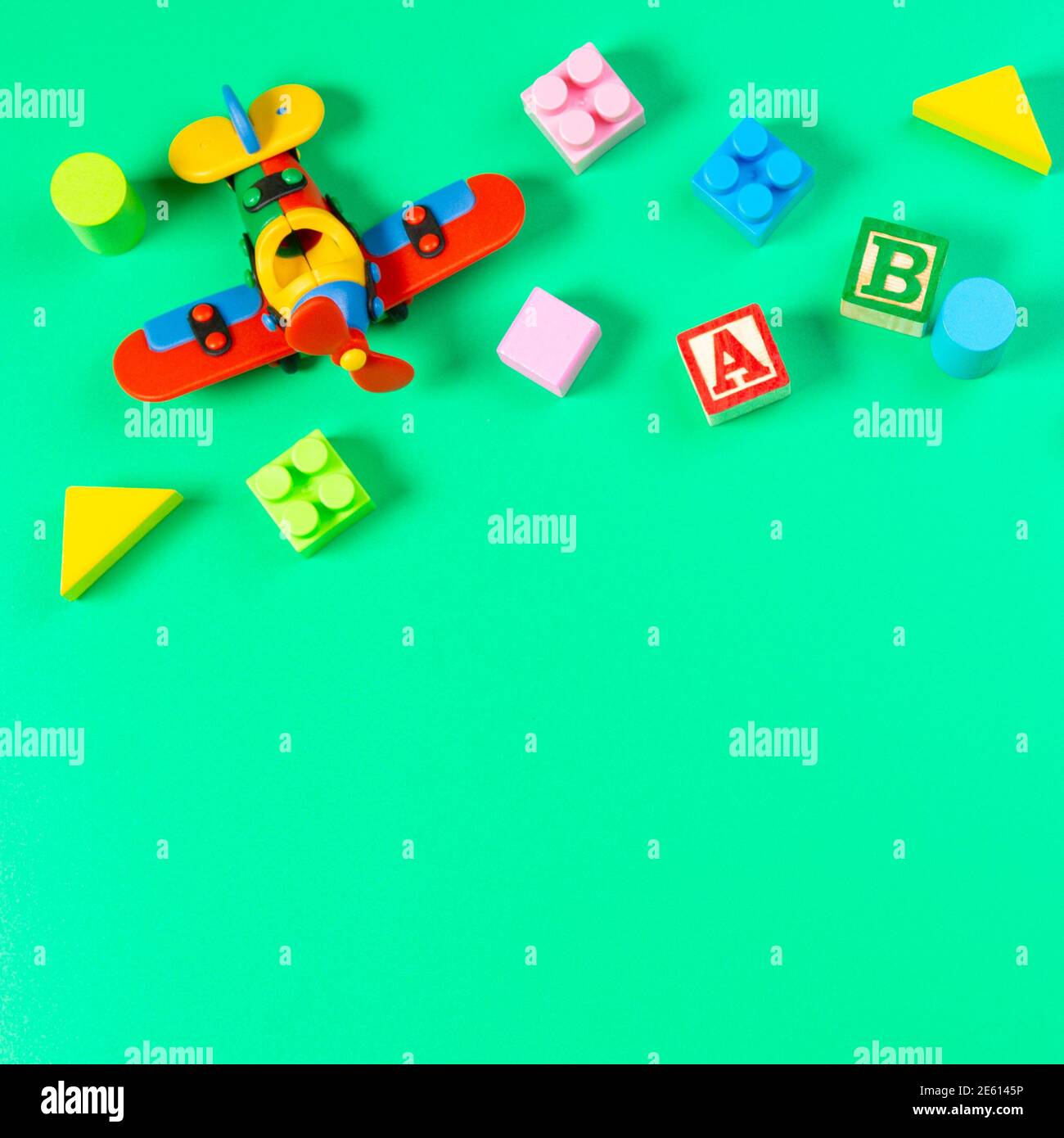 Set of colorful baby kids toys on light green background. Top view, flat lay Stock Photo Alamy