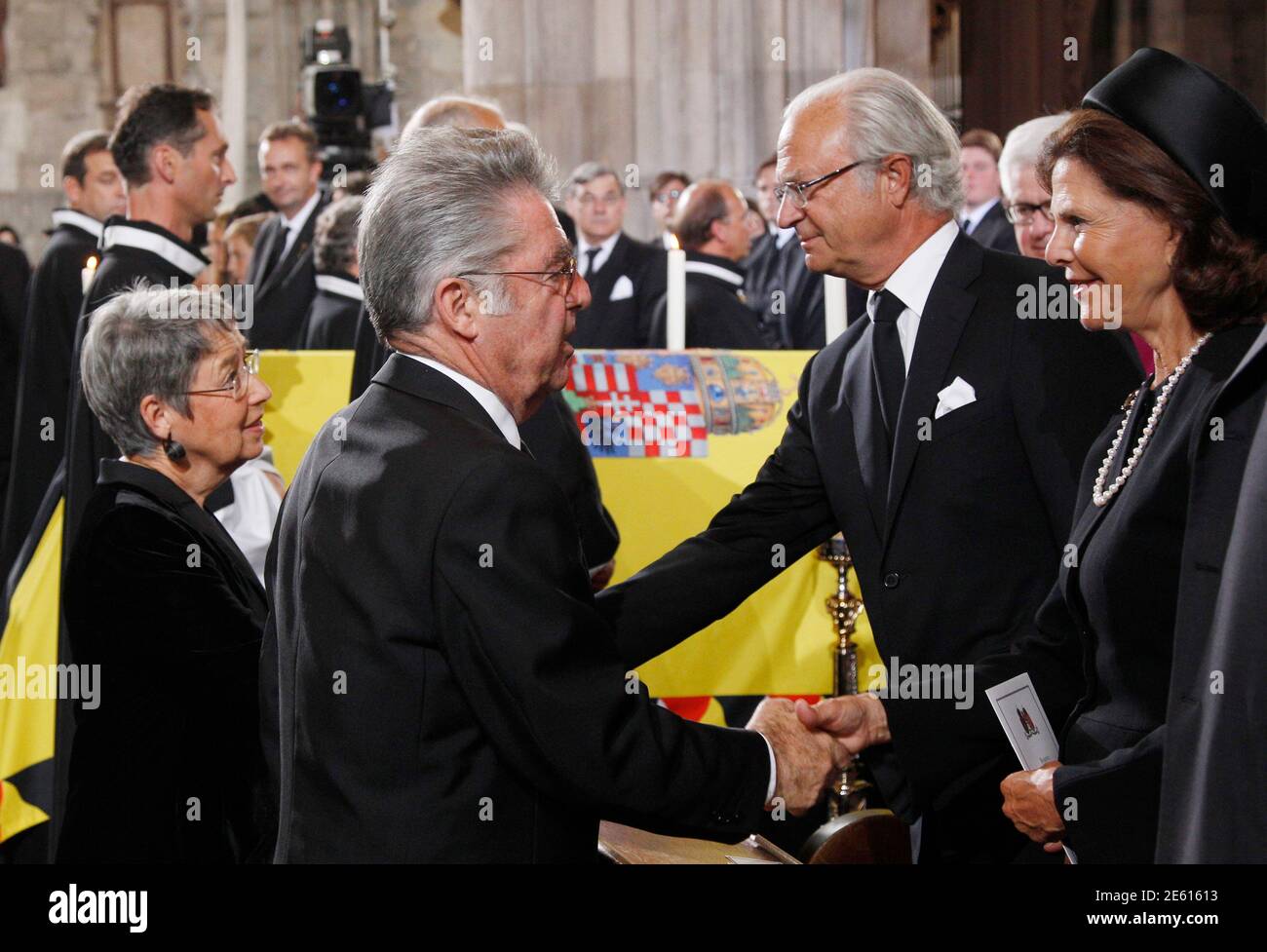 Austrian President Heinz Fischer And His Wife Margit L Shake Hands With Swedish King Carl Gustav And Queen Silvia Next To The Coffin Of Otto Von Habsburg Lothringen During The Requiem At St