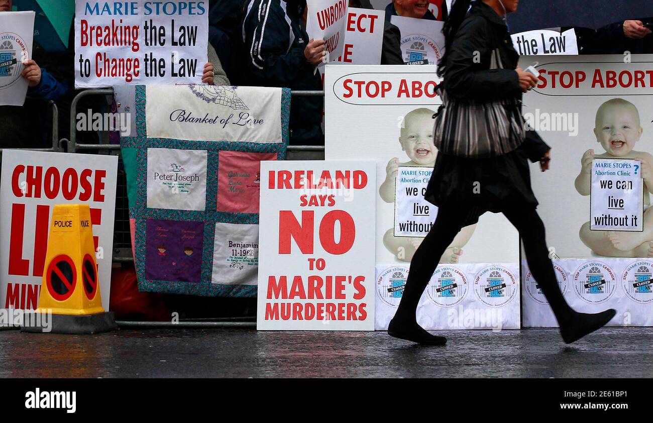 Pro-life campaigners protest outside the Marie Stopes clinic in Belfast October 18, 2012. The first private clinic offering abortions opened in Northern Ireland on Thursday, making access to abortion much easier for women in both Northern Ireland and the Republic of Ireland.    REUTERS/Cathal McNaughton   (NORTHERN IRELAND - Tags: HEALTH SOCIETY) Stock Photo