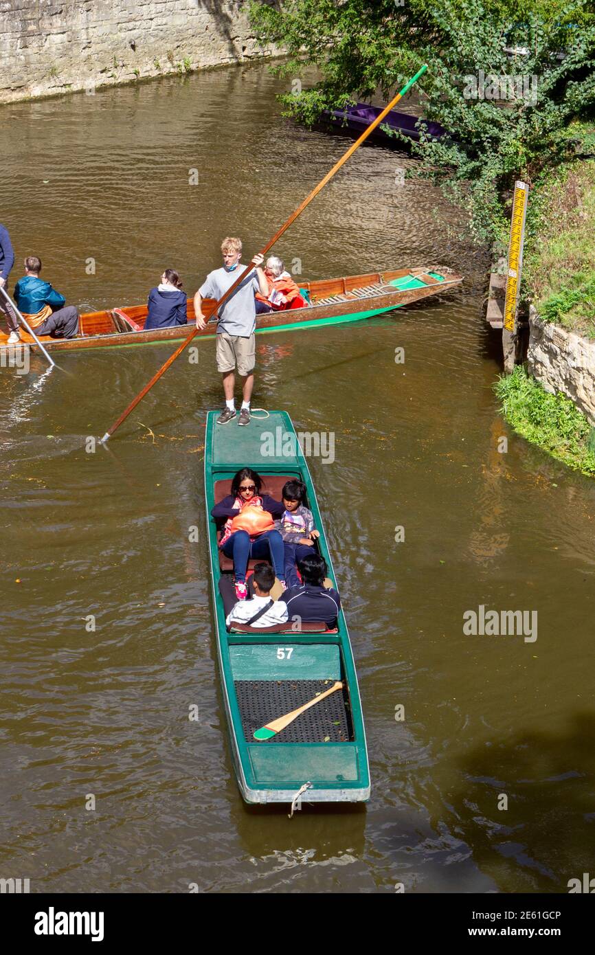 Guided punting tours on the River Cherwell beside, Magdalen Chapel, Magdalen College, High Street, Oxford, Oxfordshire, UK. Stock Photo