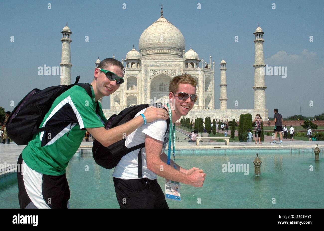 Northern Ireland's cyclists Sean Downey (L) and Philip Lavery pose for  pictures in front of historic Taj Mahal in the northern Indian city of Agra  October 12, 2010. Downey and Lavery are