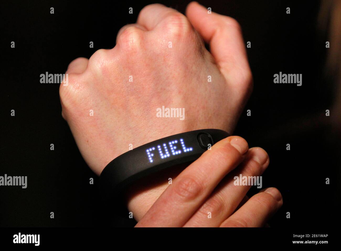 The new NIKE+ FuelBand, an innovative wristband that tracks and measures  everyday movement for what Nike says is to motivate and inspire people to  be more active, is demonstrated by a Nike