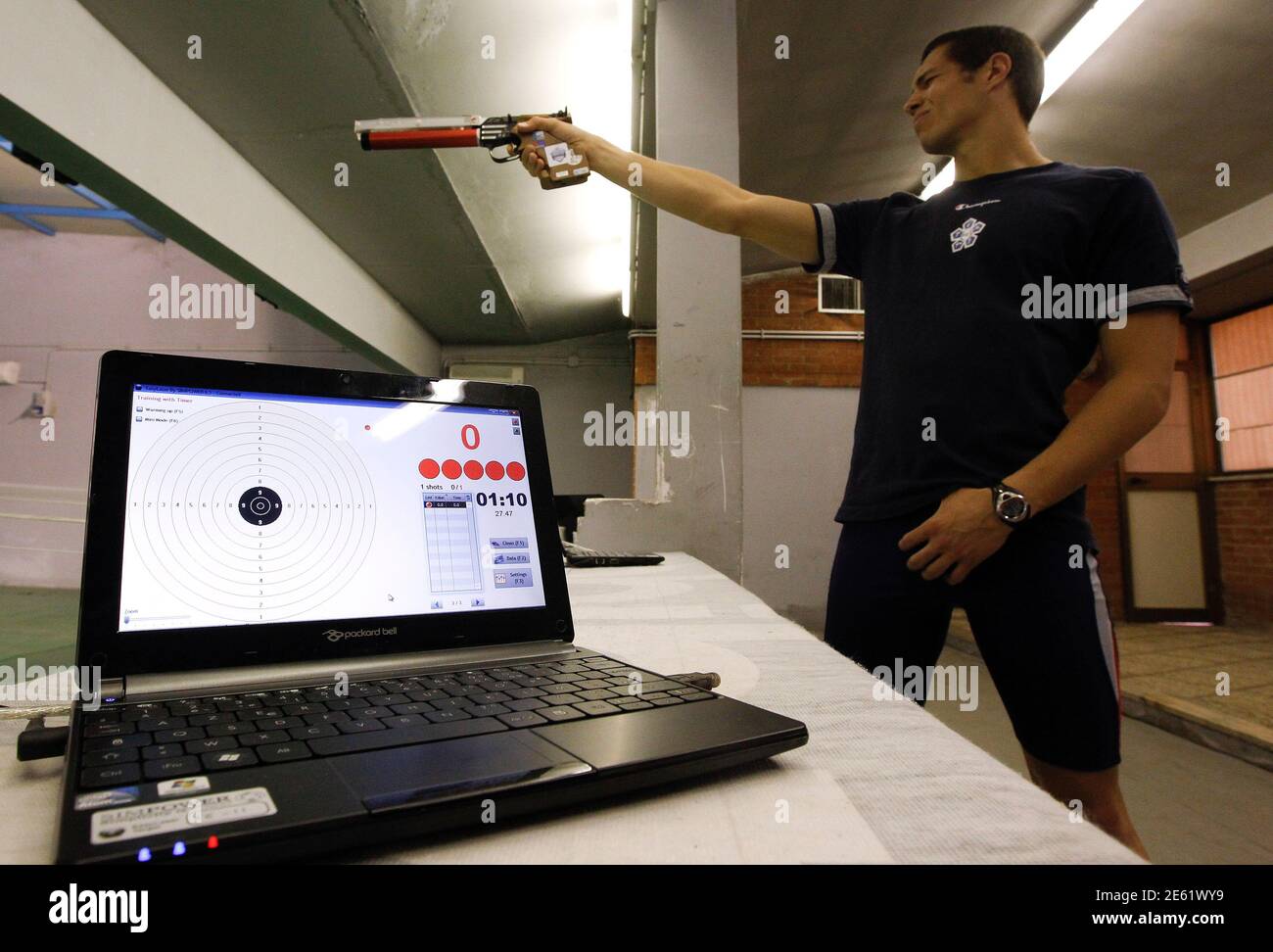 Pier Paolo Petroni, Italian pentathlon athlete, prepares to shoot during the training session at the shooting range in Montelibretti, outside Rome April 3, 2012. Laser guns will replace traditional air pistols in the modern pentathlon at the 2012 London Olympics.  REUTERS/Alessandro Bianchi (ITALY - Tags: SPORT OLYMPICS MODERN PENTATHLON) Stock Photo