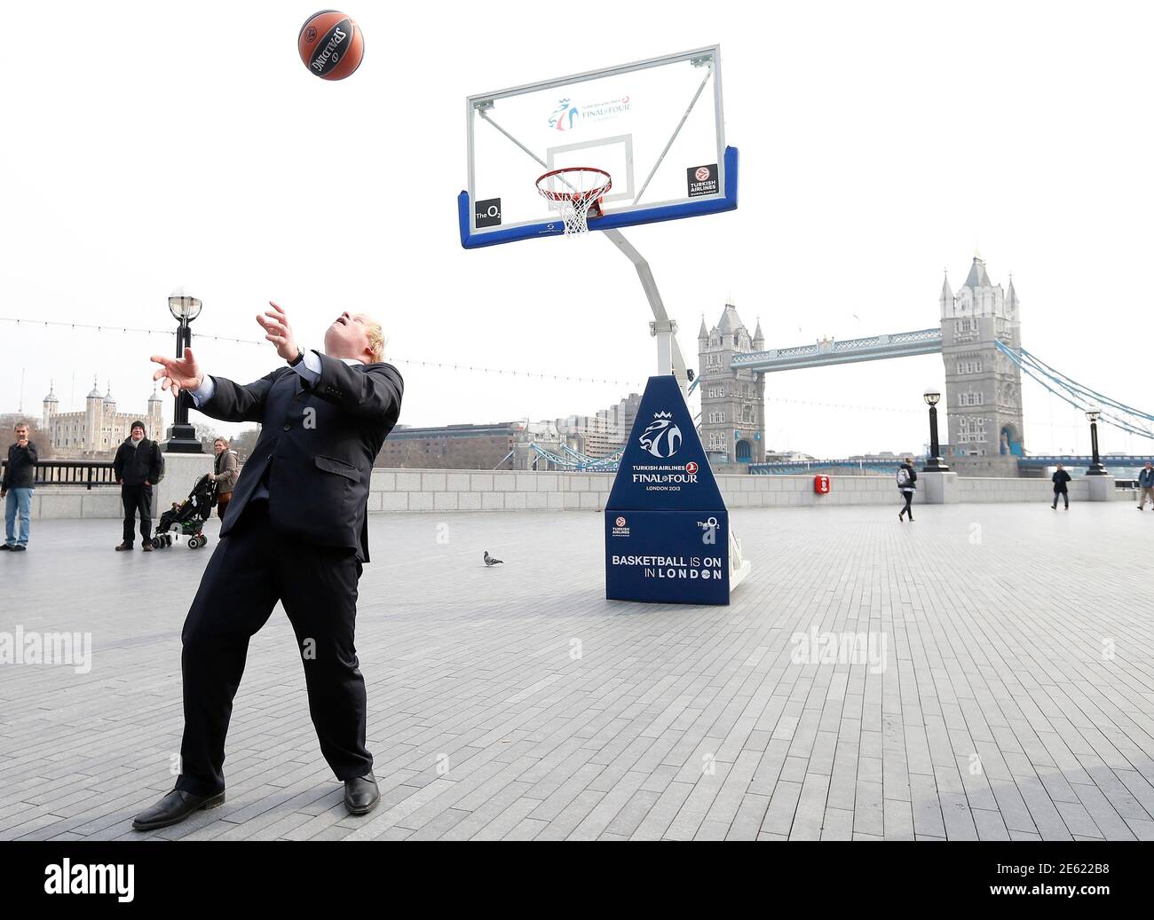 London Mayor Boris Johnson shoots and scores with his back to the basket in  London April 8, 2013. The Mayor was promoting the Euroleague Final Four  basketball series to be held at