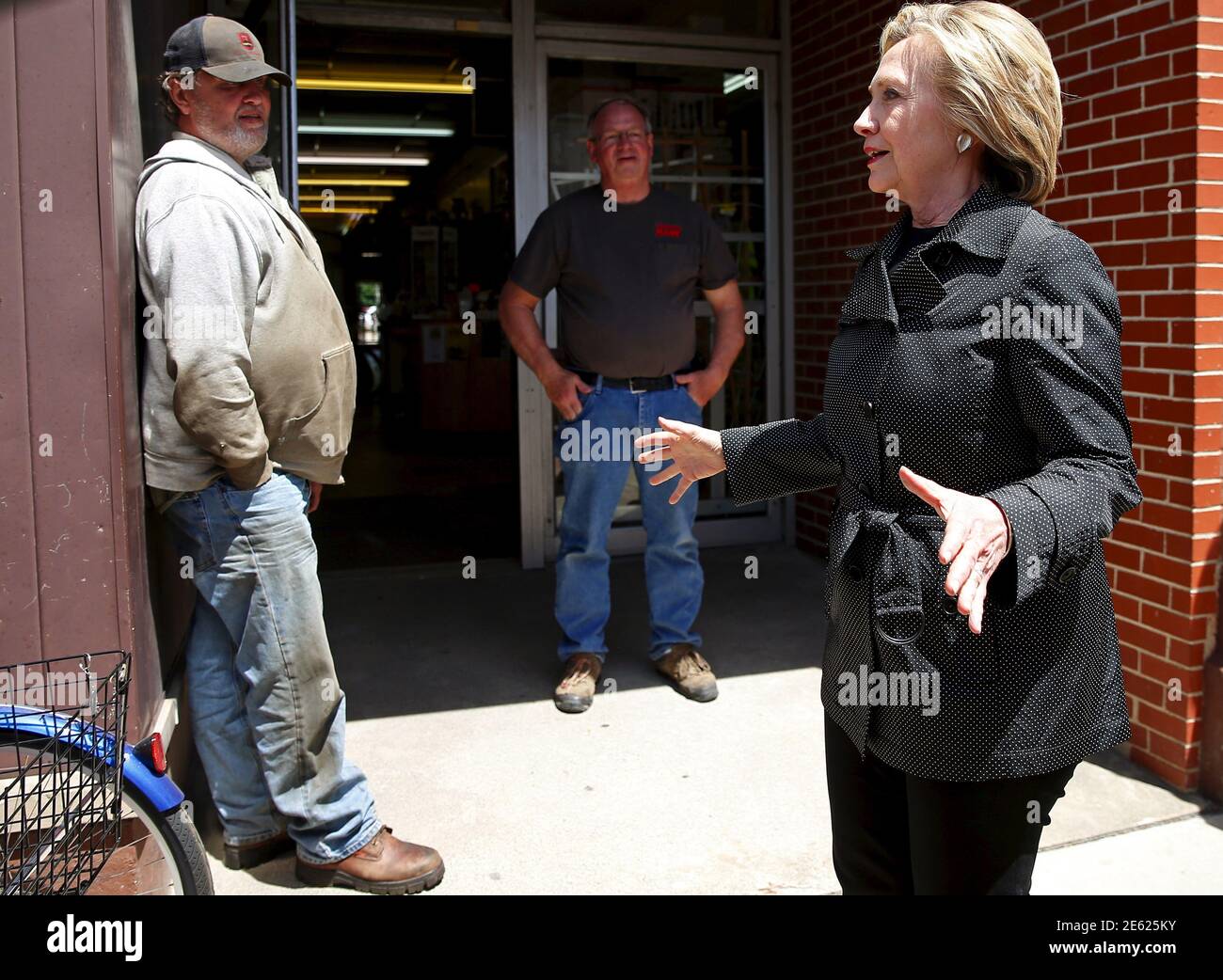 U.S. presidential candidate Hillary Clinton (R) talks to people while  walking down the street during campaign stop in Independence, Iowa, United  States, May 19, 2015. REUTERS/Jim Young Stock Photo - Alamy