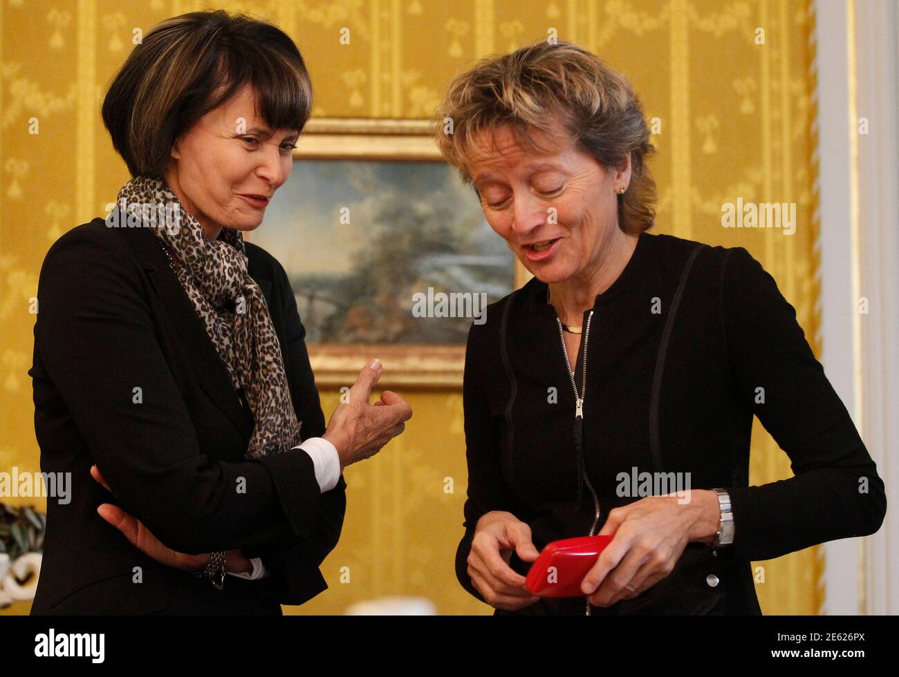 Swiss Foreign Minister Micheline Calmy-Rey (L) talks to Swiss Justice  Minister Eveline Widmer-Schlumpf ahead of the von Wattenwyl talks in Bern  September 3, 2010. REUTERS/Ruben Sprich (SWITZERLAND - Tags: POLITICS Stock  Photo -