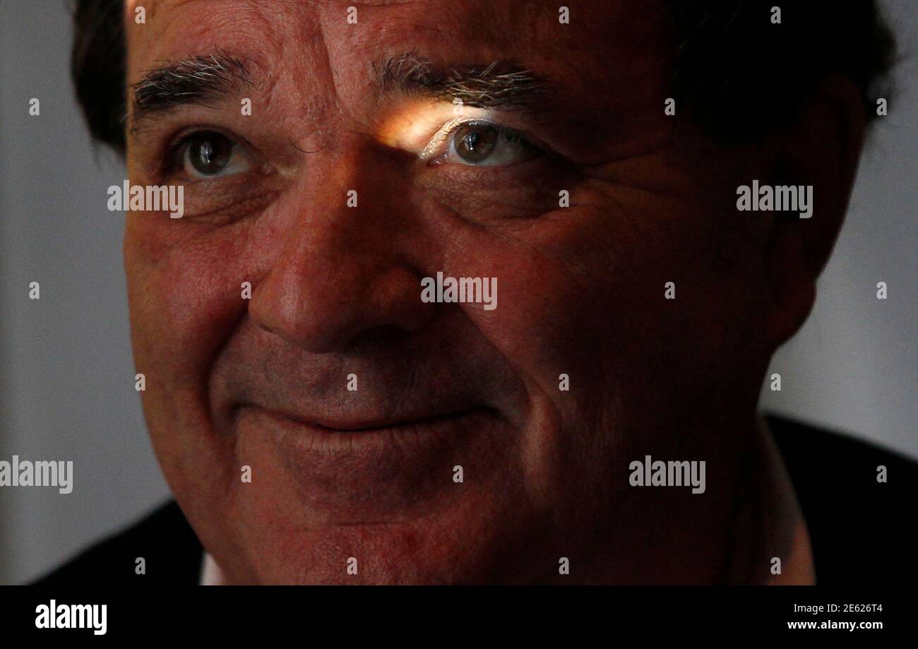 Canada's Finance Minister Jim Flaherty is illuminated by a beam of light during an interview with Reuters in his office on Parliament Hill in Ottawa August 5, 2010. The rise in Canada's currency  'makes sense' because investors are snapping up the country's assets and the economy is growing nicely, Flaherty said on Thursday.  REUTERS/Chris Wattie (CANADA - Tags: BUSINESS POLITICS) Stock Photo