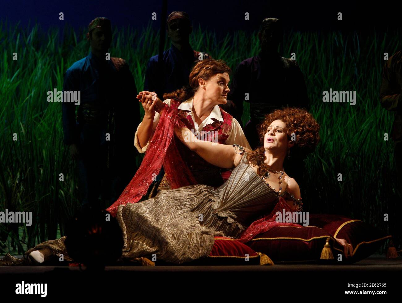 Singers Vesselina Kasarova (L) and Anja Harteros perform on stage as Ruggiero and Alcina during a dress rehearsal of George Frideric Handel's opera 'Alcina' at the state opera house in Vienna November 10, 2010. The opera is conducted by Marc Minkowski and will premiere on November 14.  REUTERS/Herwig Prammer (AUSTRIA - Tags: ENTERTAINMENT) Stock Photo