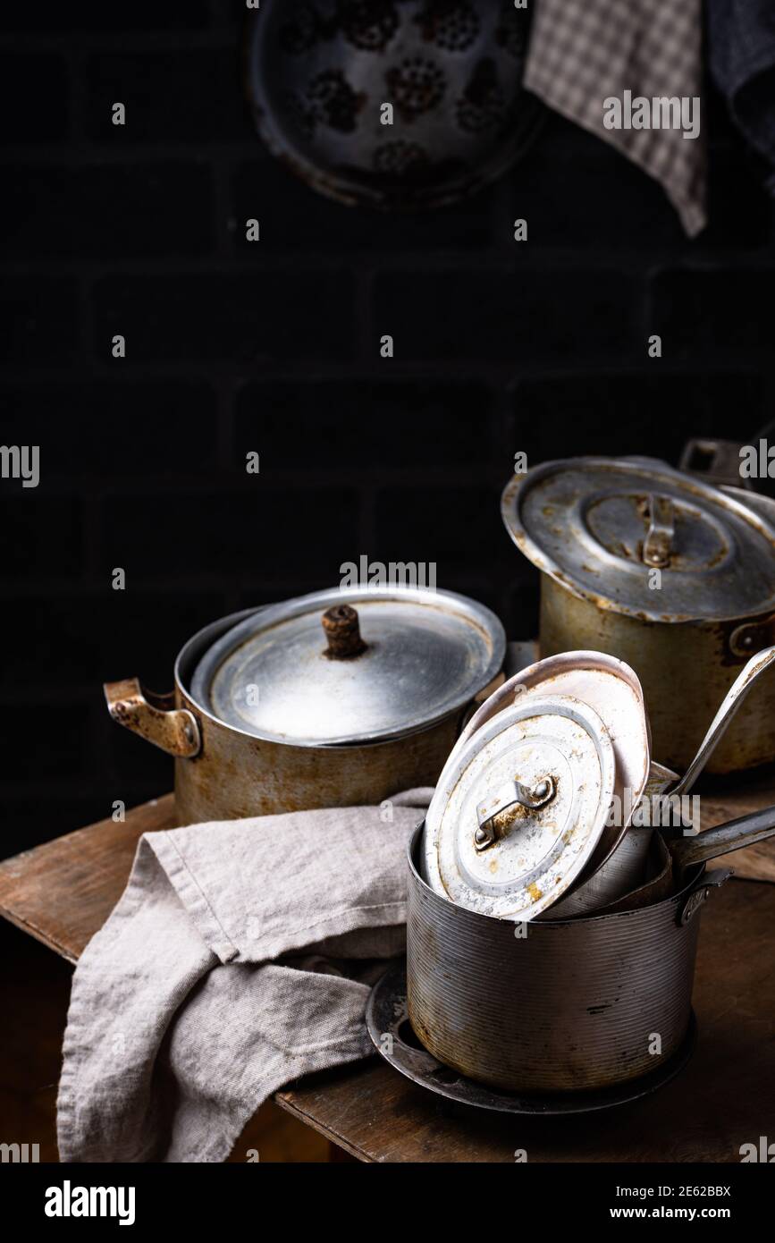 Old vintage iron pots and metallic dish Stock Photo Alamy