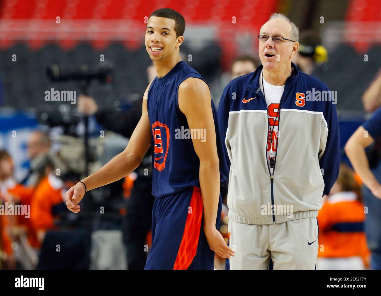 Syracuse Orange head coach Jim Boeheim (R) talks with Michael  Carter-Williams during practice for the NCAA men's basketball Final Four in  Atlanta, Georgia April 5, 2013. REUTERS/Jeff Haynes (UNITED STATES - Tags: