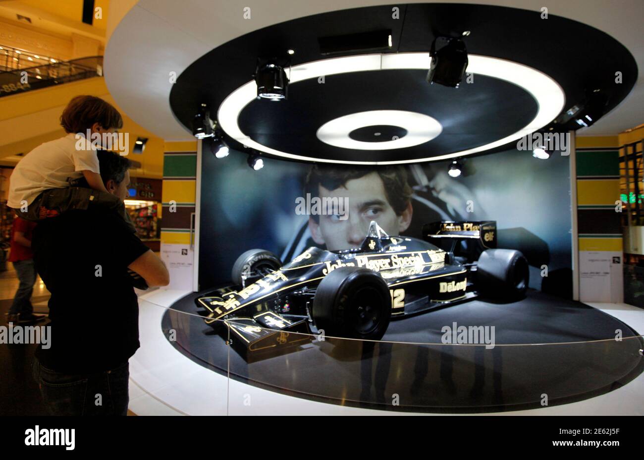 Visitors at Ayrton Senna John Player Special F1 car during an exhibition to mark the 20th anniversary of the of Brazilian triple Formula One champion Ayrton Senna in Sao