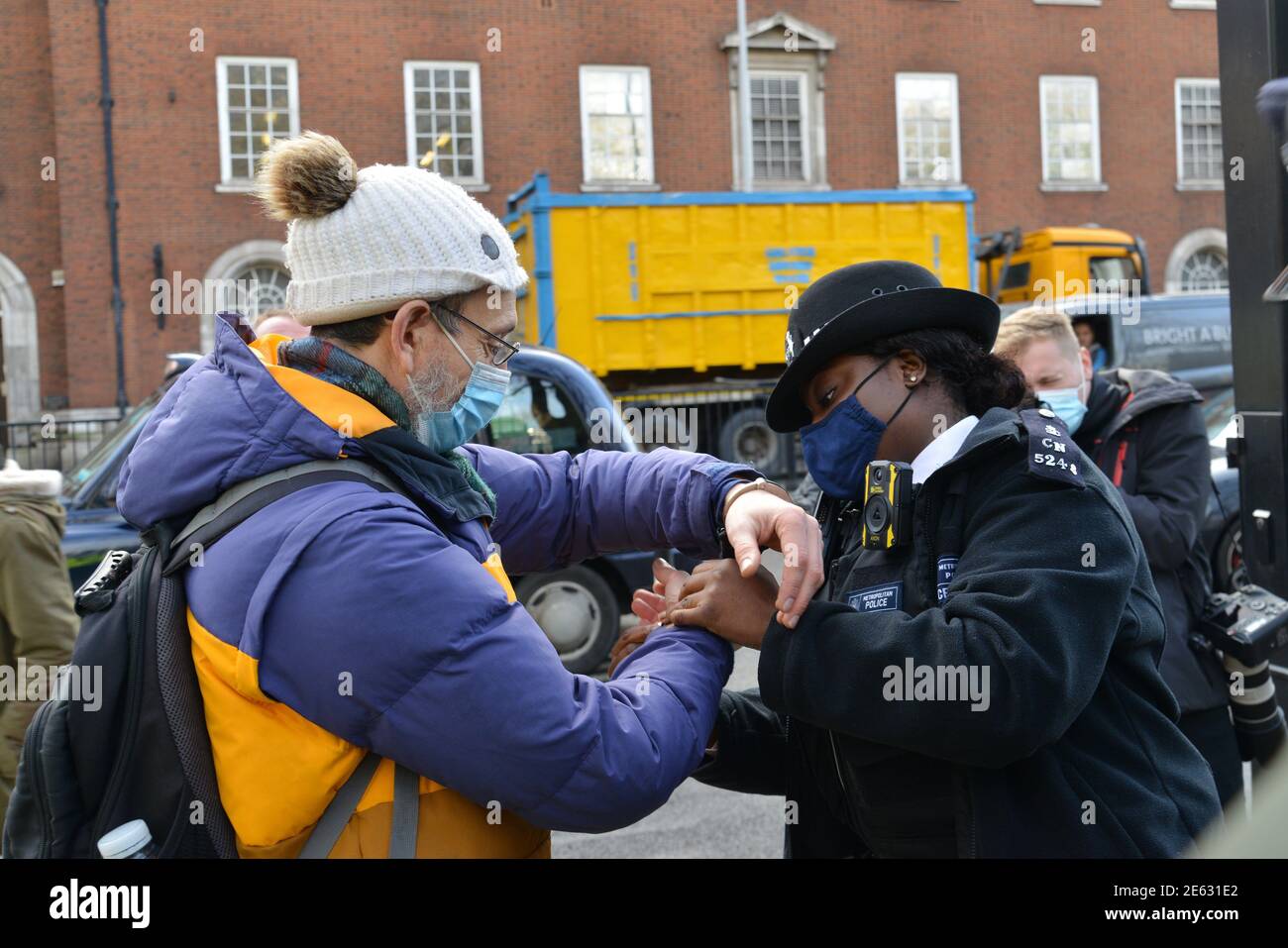 A protester from StopHS2 rebellion is arrested and handcuffed by police during the demonstration.High Speed 2 (HS2) is a planned high speed railway in the United Kingdom, with its first phase under construction. Climate Activists, and Anti-HS2 protesters (mostly from Extinction Rebellion and “Stop HS2” Activists) set up a camp in Euston Square near Euston Station, They have built tree houses and occupied tunnels under Euston Square gardens to protest against the high speed railway. Stock Photo