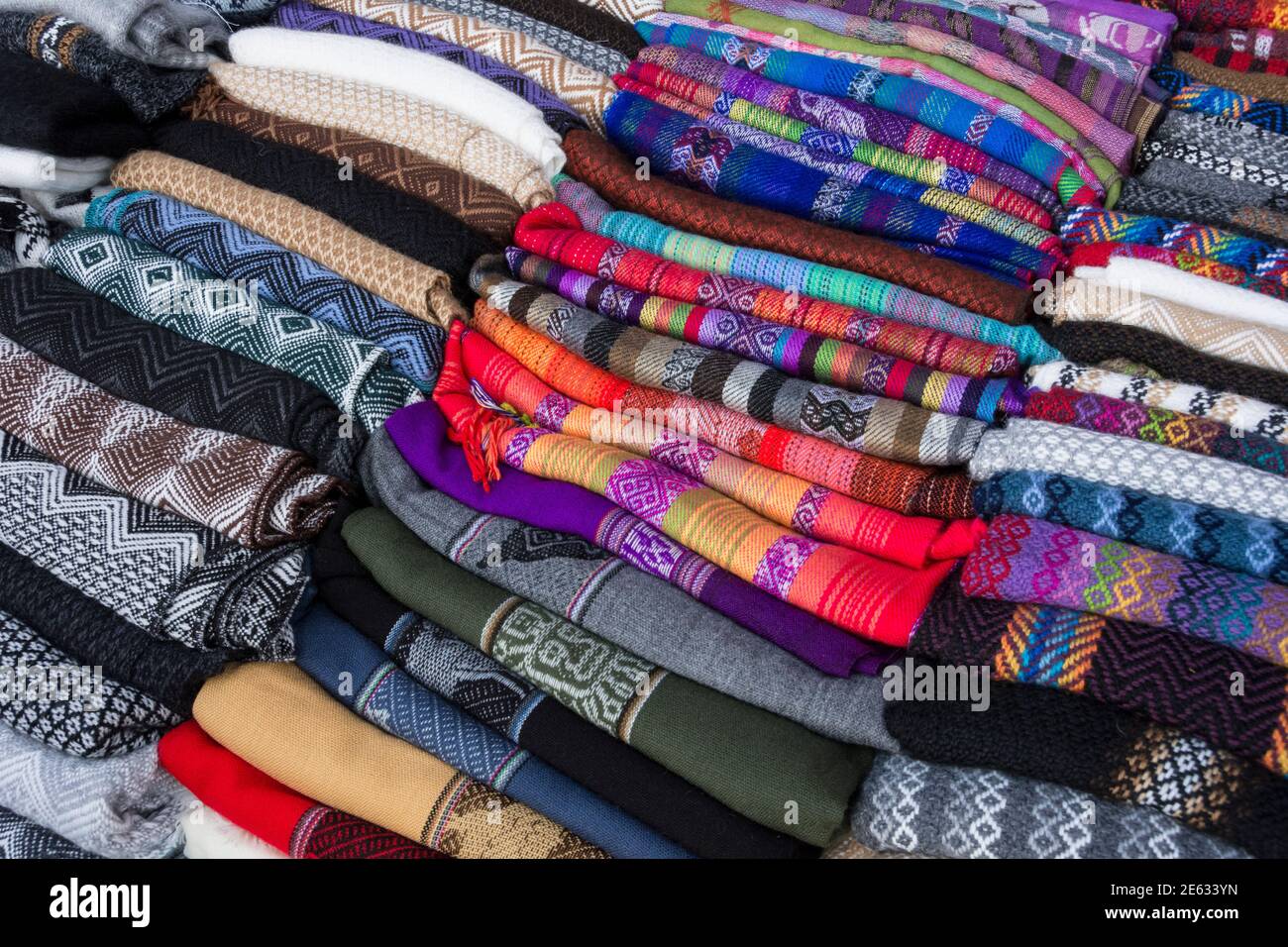 Woven cloth fabric of traditional Quechua design for sale by roadside vendor in Sacred Valley, Peru. Stock Photo