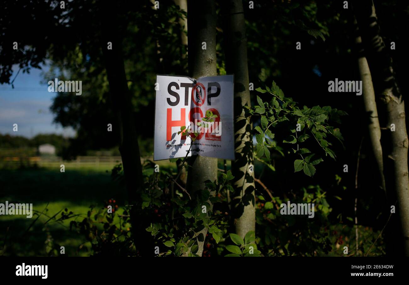 An anti high speed rail project (HS2) banner is nailed to a tree near the village of Pickmere, northern England September 9, 2013. Britain's transport secretary said the UK's planned HS2 high-speed rail network was 'essential' to the country after a group of MPs criticised the project.  REUTERS/Phil Noble (BRITAIN - Tags: BUSINESS POLITICS TRANSPORT) Stock Photo