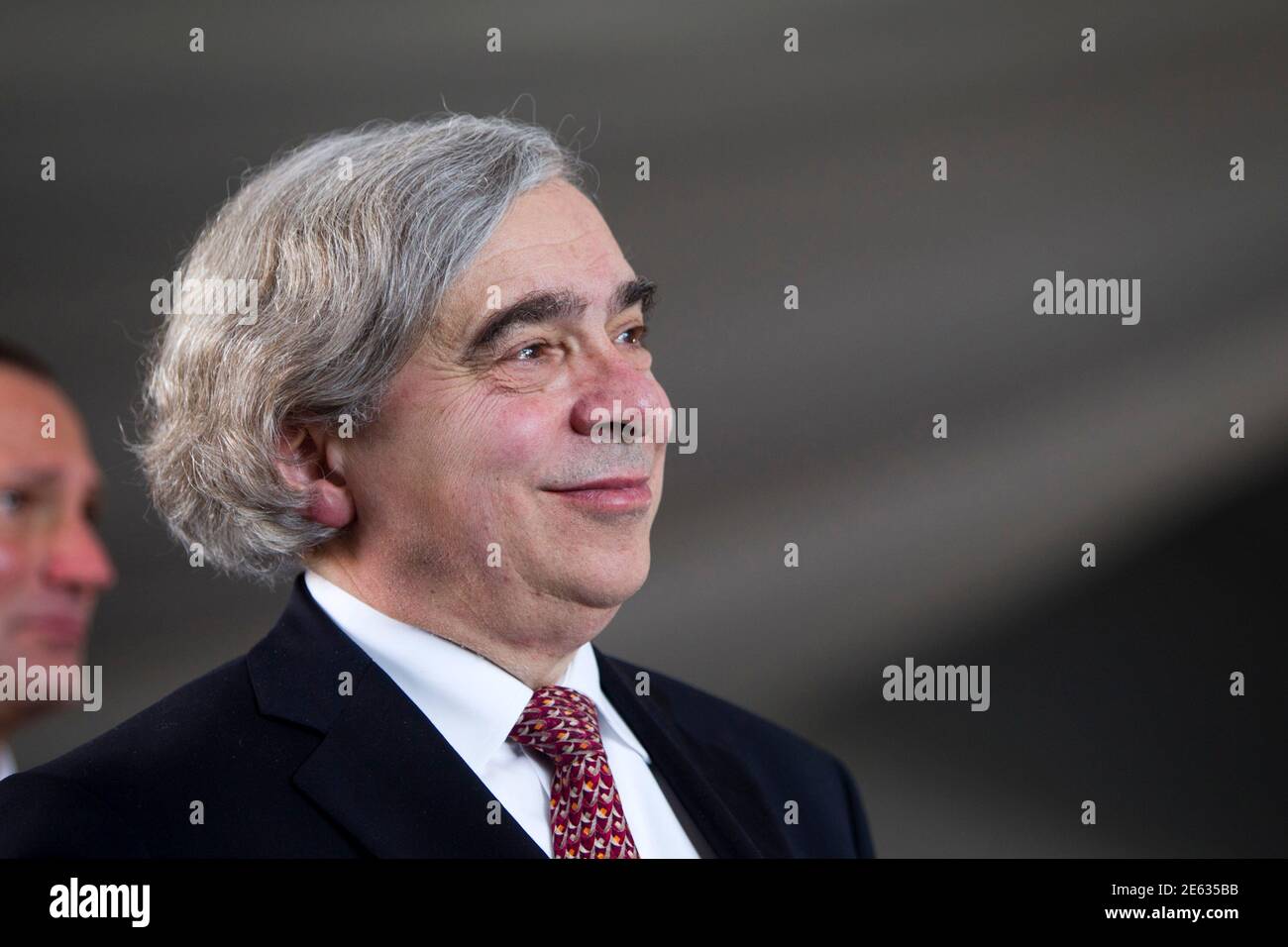 United States Secretary of Energy Ernest Moniz attends the grand opening of the Ivanpah Solar Electric Generating System in the Mojave Desert near the California-Nevada border February 13, 2014. The project, a partnership of NRG, BrightSource, Google and Bechtel, is the world's largest solar thermal facility and uses 347,000 sun-facing mirrors to produce 392 Megawatts of electricity, enough energy to power more than 140,000 homes. REUTERS/Steve Marcus (UNITED STATES - Tags: ENERGY SCIENCE TECHNOLOGY BUSINESS POLITICS) Stock Photo