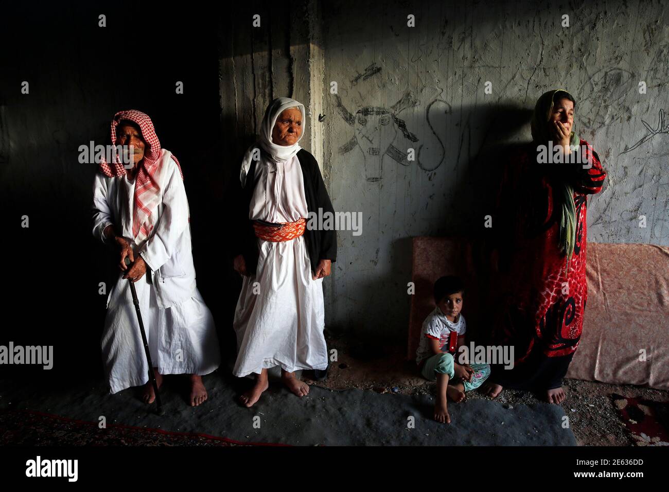 Displaced People From The Minority Yazidi Sect Who Fled The Violence In The Iraqi Town Of Sinjar Wait For Aid At An Abandoned Building That They Are Using As Their Main Residence