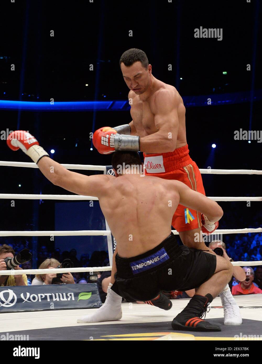 WBA, WBO, IBO and IBF heavyweight boxing world champion Vladimir Klitschko knocks down his Bulgarian Kubrat Pulev during their title fight in Hamburg, November 15, 2014. REUTERS/Fabian Bimmer (GERMANY -