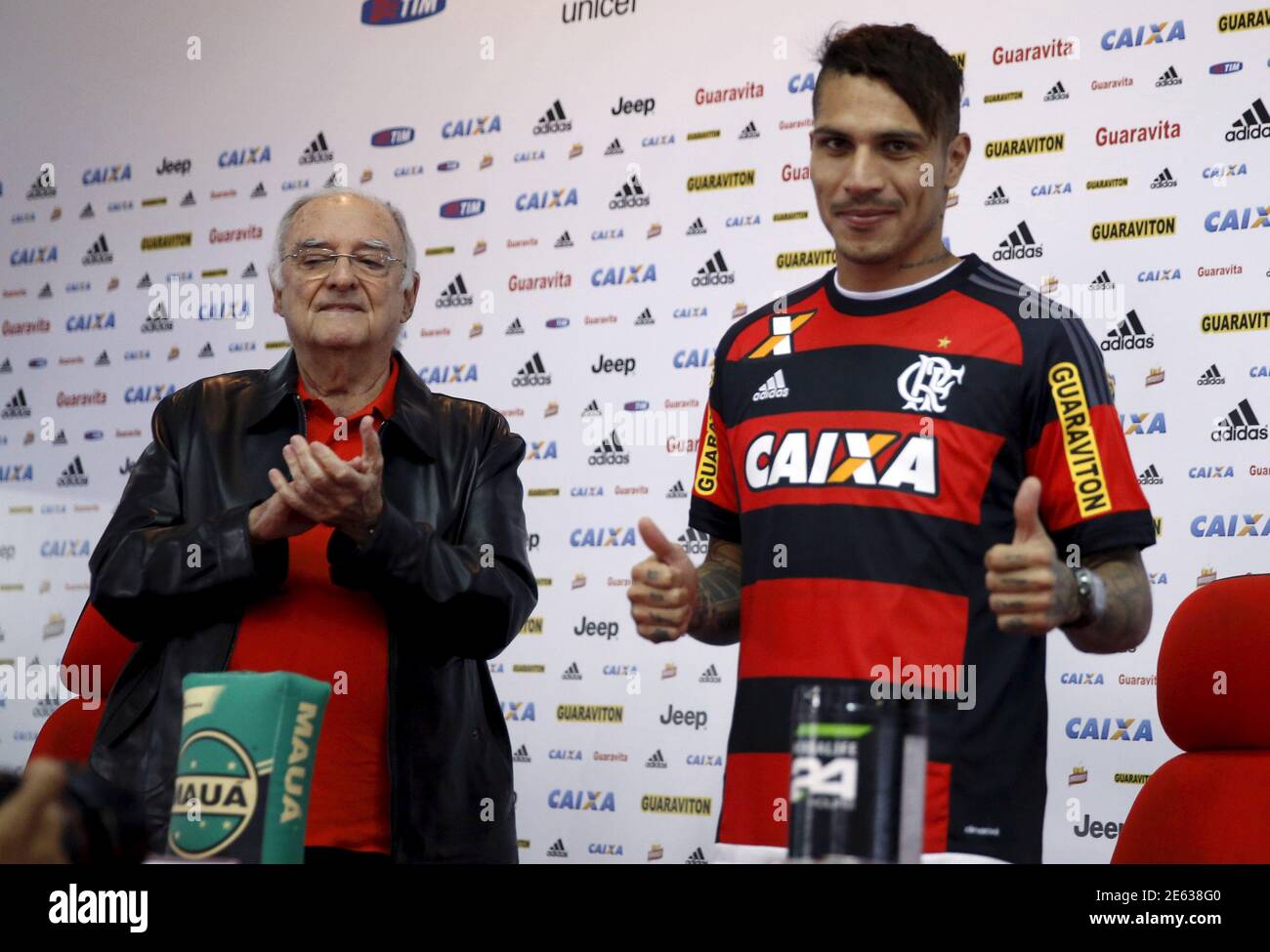 Flamengo's new soccer player Paolo Guerrero, accompanied by vice-president Walter D'Agostino, poses wearing the club jersey during his presentation in Rio de Janeiro, Brazil July 7, 2015. REUTERS/Pilar Olivares Stock Photo