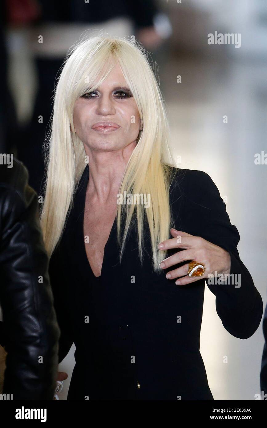 Italian designer Donatella Versace attends the presentation of designer  Anthony Vaccarello's Autumn/Winter 2015/2016 women's ready-to-wear  collection during Paris Fashion Week March 3, 2015. Picture taken March 3,  2015. REUTERS/Charles Platiau (FRANCE -
