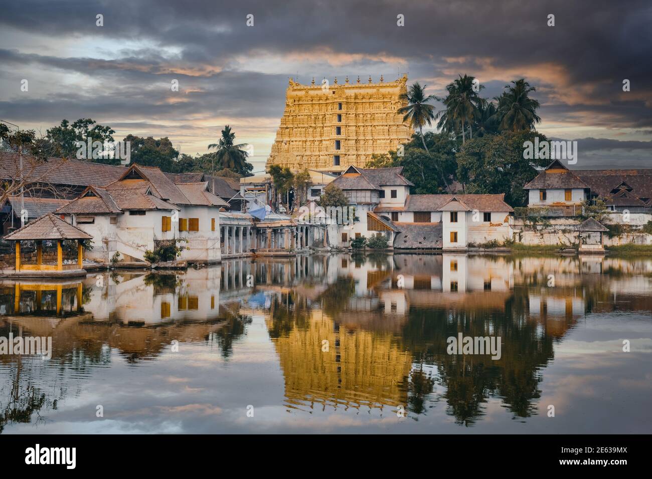 Beautiful gold Sree Padmanabhaswamy temple reflected in a pond at sunset, Thiruvananthapuram city, Kerala, south India Stock Photo