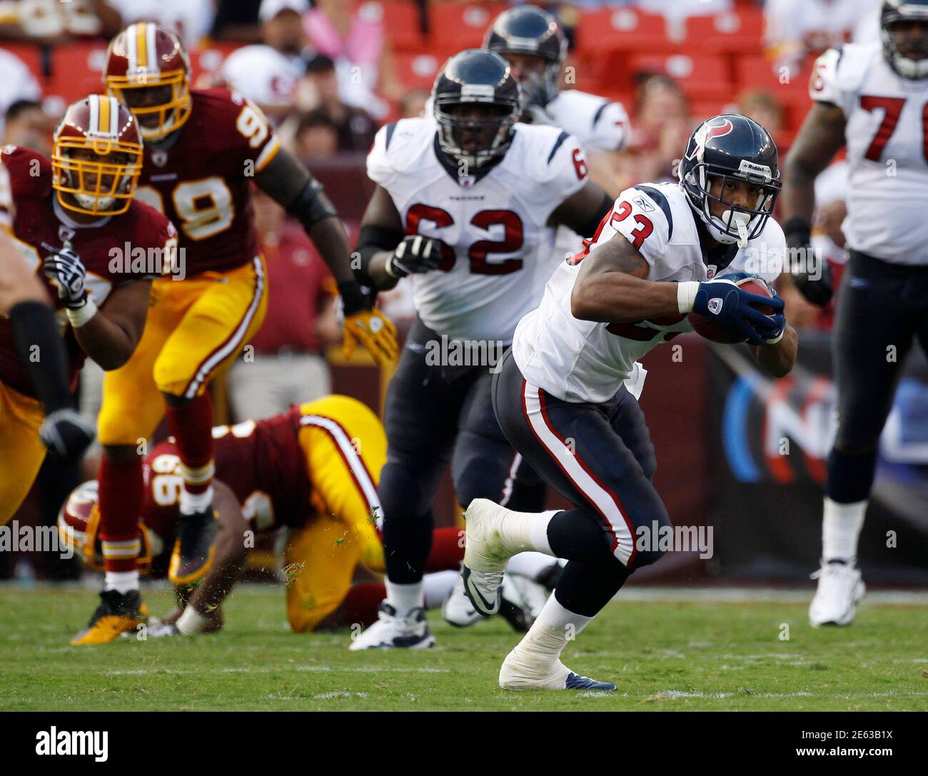 Washington Redskins chase Houston Texans Arian Foster in the second quarter of NFL football game in Landover, Maryland, September 19, 2010.   REUTERS/Larry Downing (UNITED STATES - Tags: SPORT FOOTBALL) Stock Photo