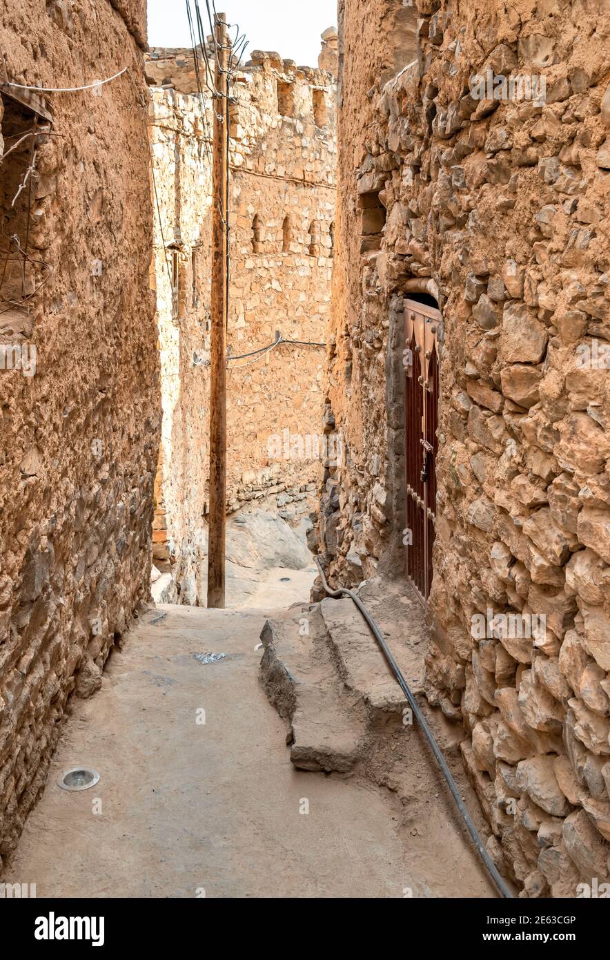 Narrow alleyway in the old mountain village Misfat Al Abriyeen in Sultanate of Oman. Stock Photo