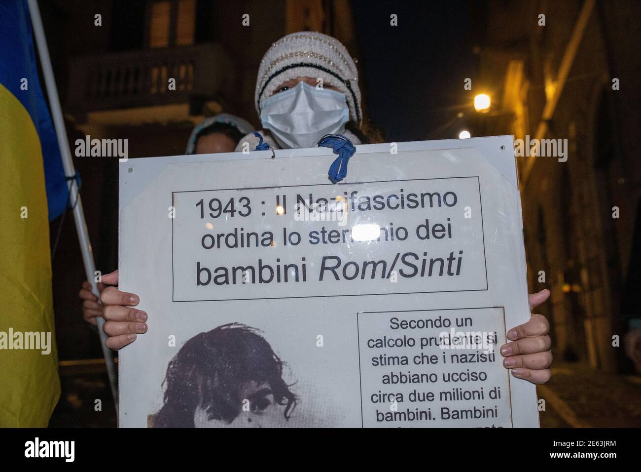 Rome, Italy. 27th Jan, 2021. (1/27/2021) A girl shows a sign on the extermination of children of the Rom-Sinti people by the Nazi-Fascists (Photo by Matteo Nardone/Pacific Press/Sipa USA) Credit: Sipa USA/Alamy Live News Stock Photo