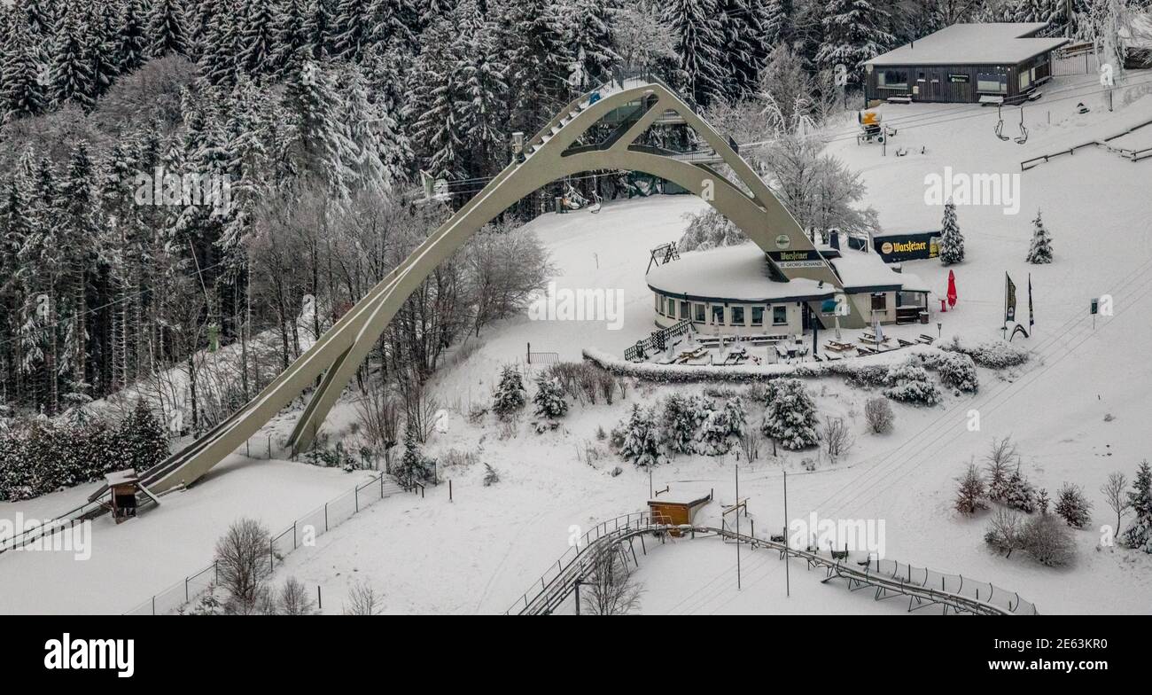 Aerial view of snowy winter landscape of Winterberg with St. George ski jump in Sauerland in North Rhine-Westphalia, Germany, Sauerland, Europe, aeria Stock Photo