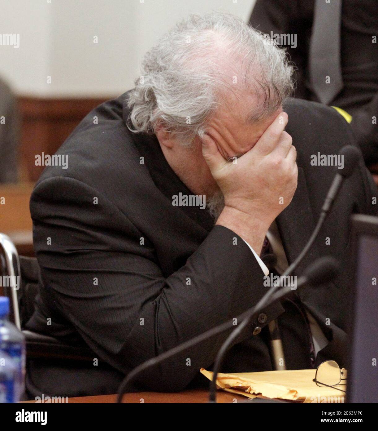 Accused Craigslist killer Richard Beasley reacts while jury verdict forms are checked after being found guilty in Summit County Court of Common Pleas courtroom in Akron, Ohio March 12, 2013. An Ohio jury found Beasley guilty of murder on Tuesday for his role in a 2011 scheme that lured down-on-their-luck men to their deaths with an ad for a non-existent job on Craigslist. REUTERS/Mike Masturzo/Akron Beacon Journal/Pool  (UNITED STATES - Tags: CRIME LAW) Stock Photo