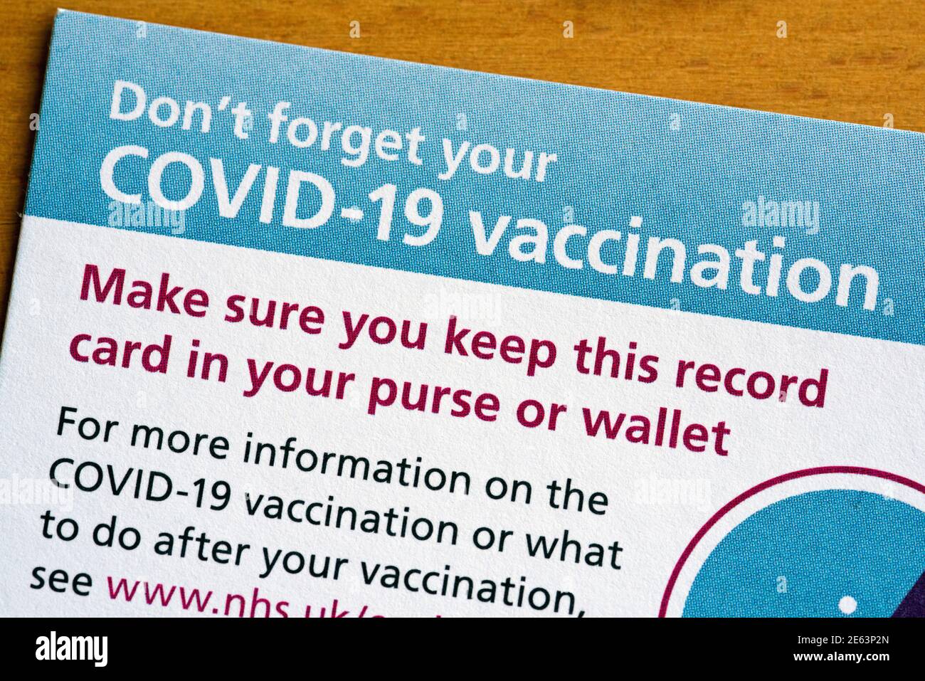 Close up of Covid-19 Vaccination or Vaccine Card Stock Photo