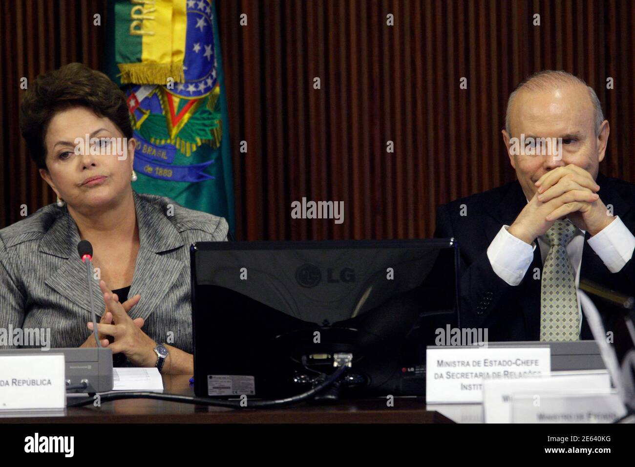 Brazil's President Dilma Rousseff (L) and Finance Minister Guido Mantega attend a meeting with a political council in Brasilia August 29, 2011. Rousseff will outline a tight budget for next year on Monday, government sources said, reaffirming her commitment to spending control and paving the way for interest rate cuts.        REUTERS/Ueslei Marcelino (BRAZIL - Tags: POLITICS BUSINESS TPX IMAGES OF THE DAY) Stock Photo