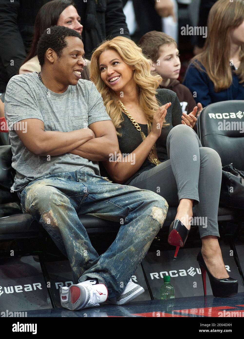 Jay Z and his wife Beyonce (wearing Christian Louboutin shoes) watch the  New Jersey Nets play the Phoenix Suns in the second quarter of their NBA  basketball game in Newark, New Jersey,