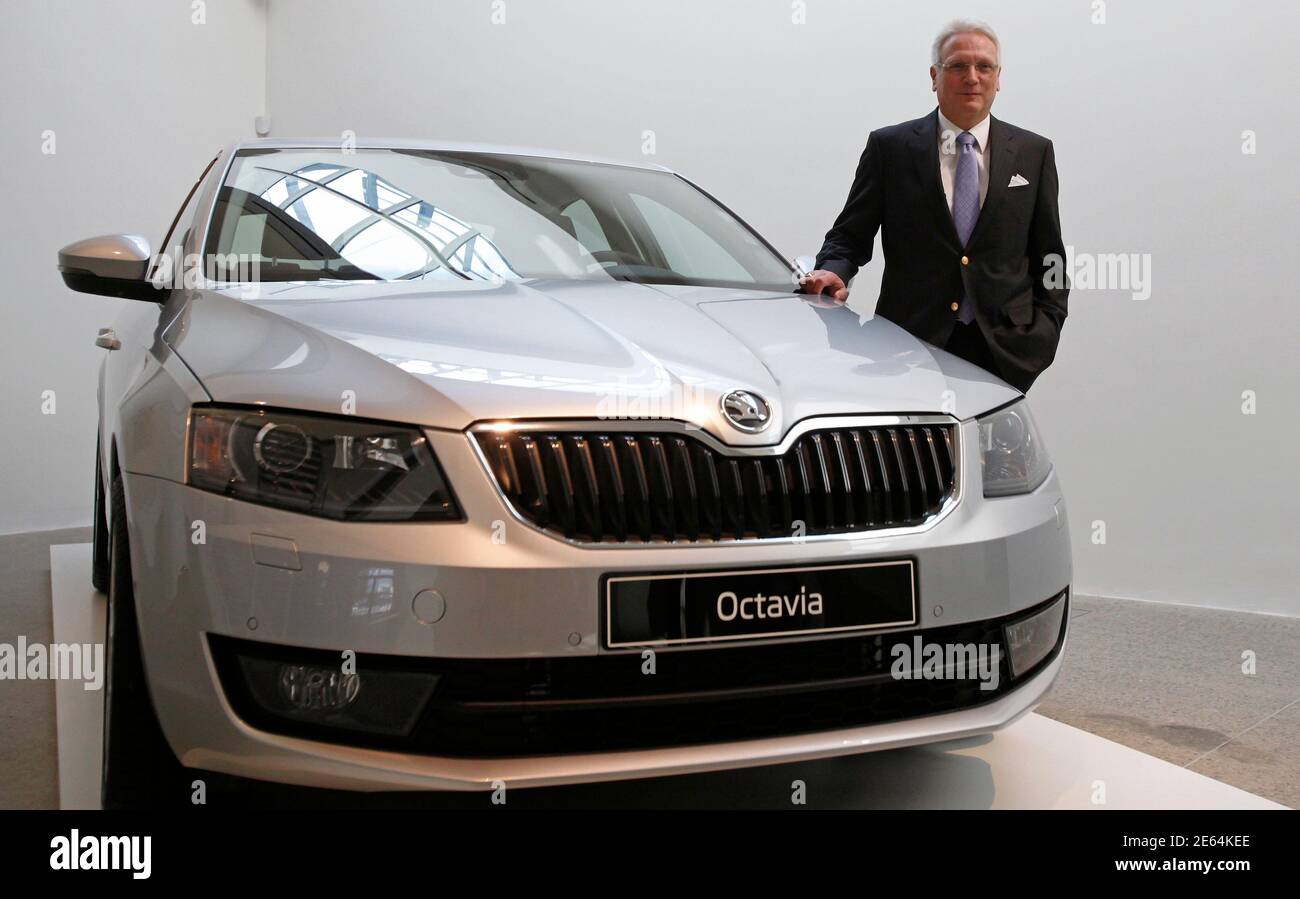 reform cleaner Artist Skoda's Chairman Winfried Vahland poses with a new Skoda Octavia car after  a presentation of the company's annual results in Mlada Boleslav March 20,  2013. Czech Volkswagen unit Skoda Auto is confident