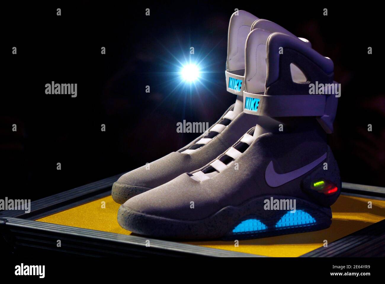 A pair of 2011 NIKE MAG shoes, based on the original NIKE MAG worn in 2015  by the "Back to the Future" character Marty McFly, played by Michael J.  Fox, is displayed