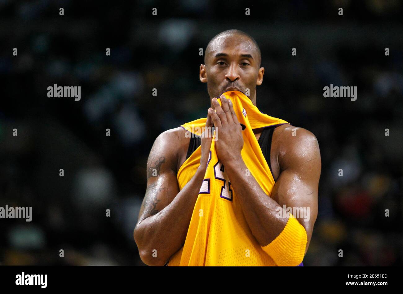 Los Angeles Lakers Kobe Bryant bites his jersey during a break in action  against the Boston Celtics in the first half of their NBA basketball game  at TD Garden in Boston, Massachusetts