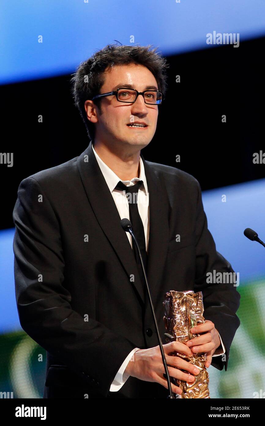 Director Olivier Treiner reacts after winning the Best short film Award for  the film "The Piano Tuner" (L'accordeur) during the 37th Cesar Awards  ceremony in Paris February 24, 2012. REUTERS/Benoit Tessier (FRANCE -