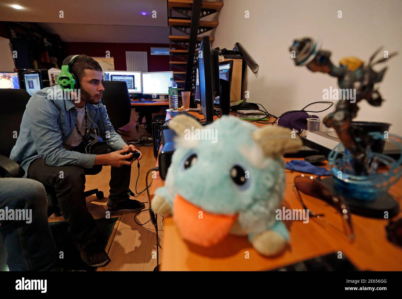 Millenium eSport professional gamer Samir of France, nicknamed  D1abloZeTank, looks at a computer screen as he plays inside the Millenium  Gaming House in Marseille Novembre 13, 2013. The Millenium Gaming House,  which