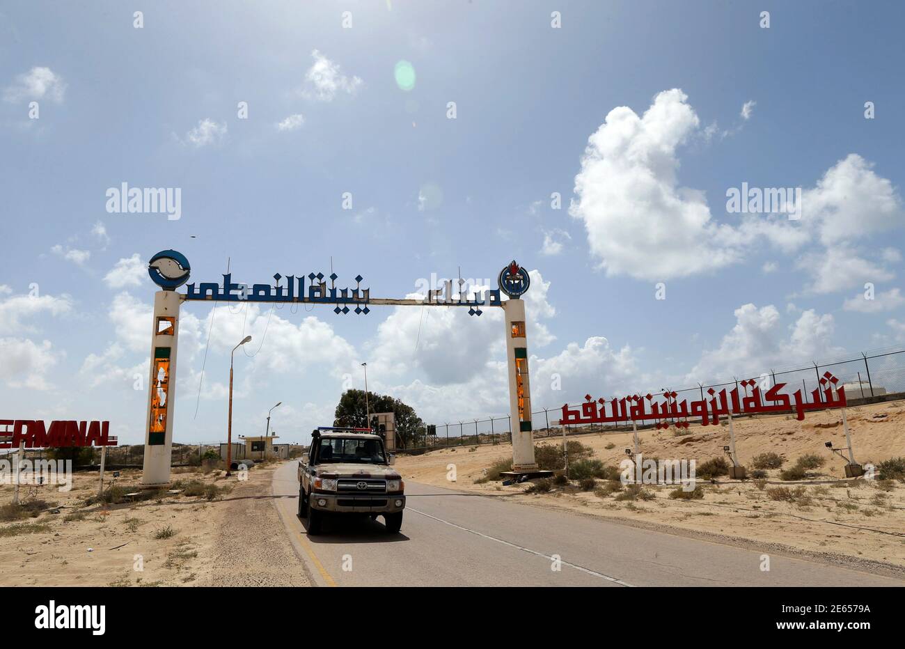 The entrance to the Zueitina oil terminal is seen in Zueitina, west of Benghazi April 7, 2014. Libya's Zueitina oil port prepared on Monday to load crude on tankers after the government reached a deal with rebels to reopen four terminals that insurgents have occupied since summer. The federalist rebels agreed on Sunday to end gradually their eight-month blockade of Zueitina, Hariga, Ras Lanuf and Es Sider ports, which account for around 700,000 barrels per day of the OPEC country's crude exports. REUTERS/Esam Omran Al-Fetori (LIBYA  - Tags: POLITICS ENERGY BUSINESS) Stock Photo